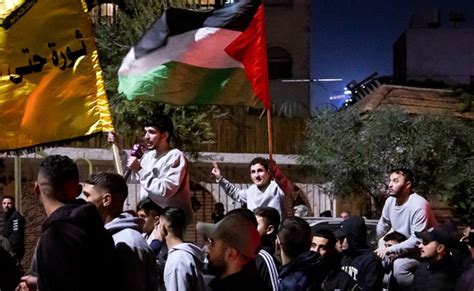 Palestinian prisoners released by Israel under cease-fire deal arrive in West Bank city